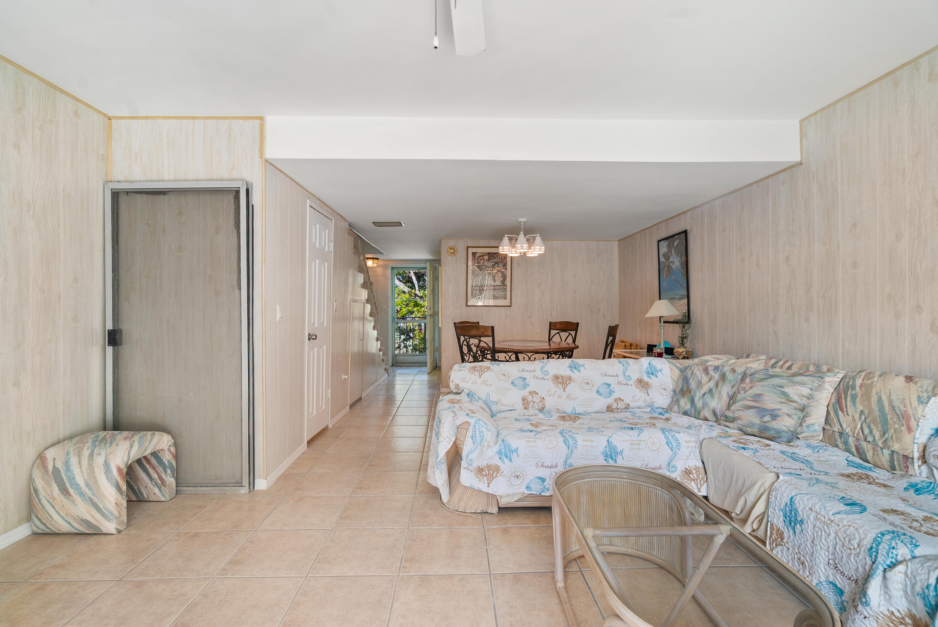 300 Ocean Drive, Unit 23 Key Largo, FL 33037 - Photo 9 of 29 a living room with furniture and a table