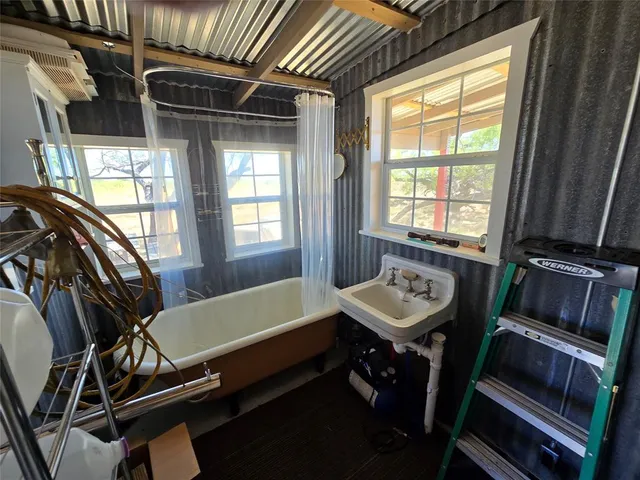 a bathroom with a sink and a bathtub