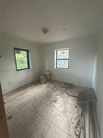 a view of an empty room and window