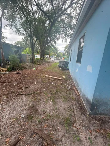 a view of a backyard of the house