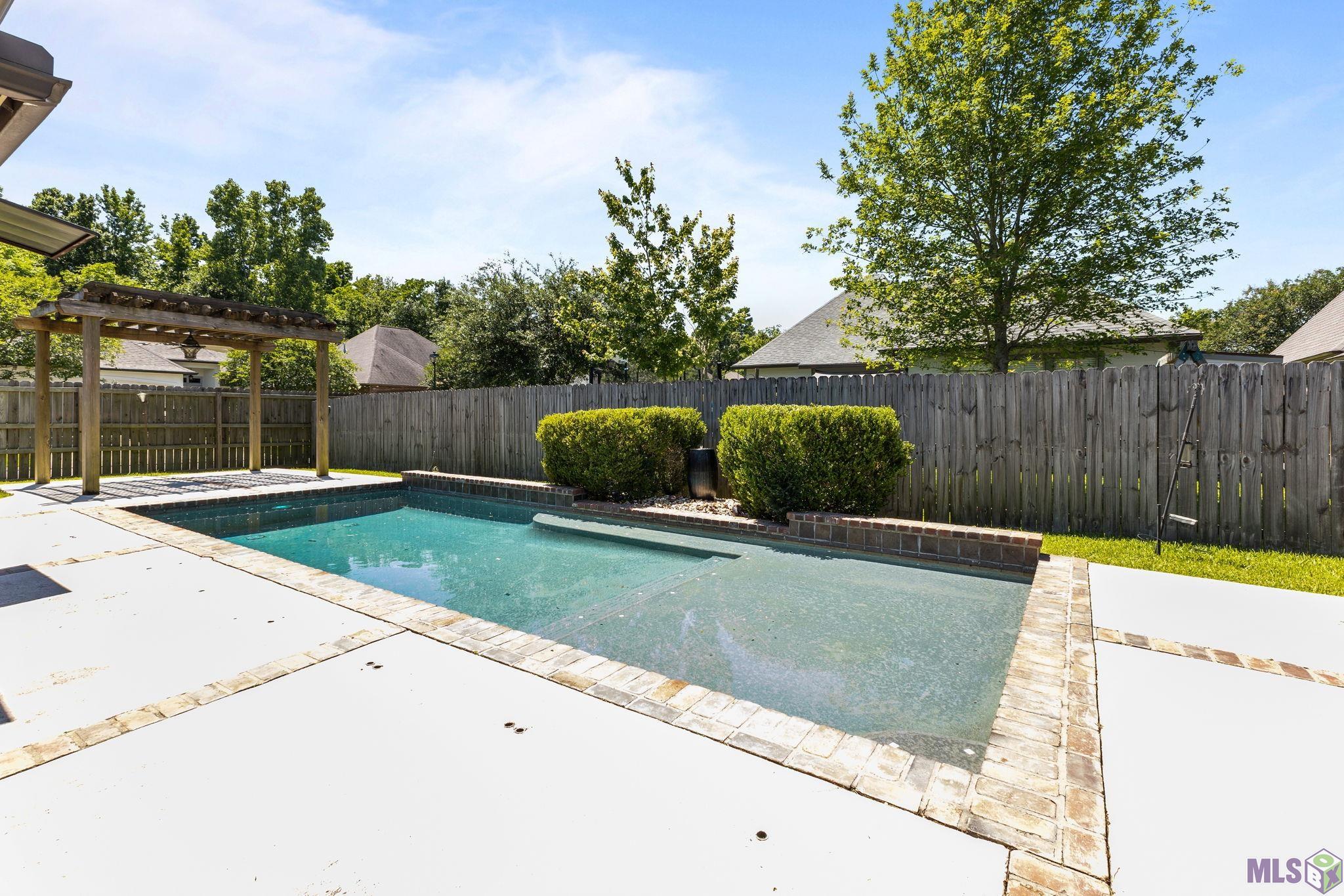 703 Ross's Turn Baton Rouge, LA 70810 - Photo 22 of 27 Swimming pool with Pergola