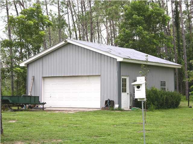 1423 Vinson Ray Road Baker, FL 32531 - Photo 15 of 16 a house with a yard