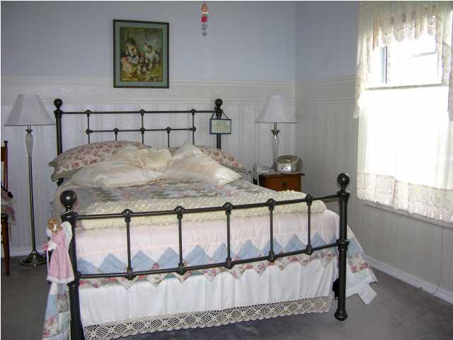 1423 Vinson Ray Road Baker, FL 32531 - Photo 9 of 16 a bedroom with a bed and a window