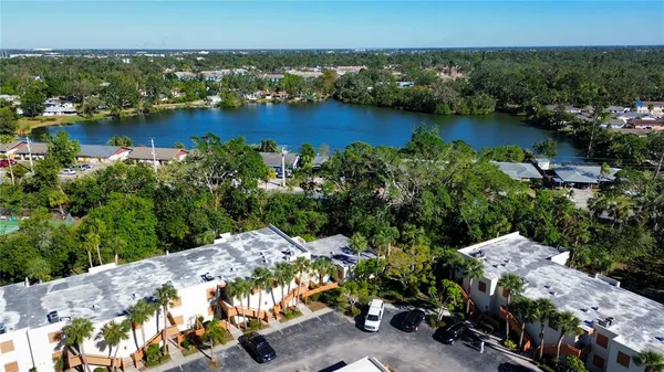 an aerial view of a house with a lake view
