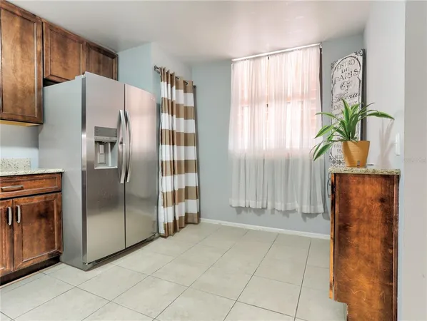 a kitchen with stainless steel appliances a refrigerator and a stove