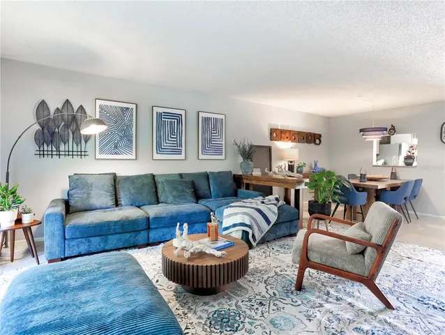 a view of a dining room with furniture and a livingroom