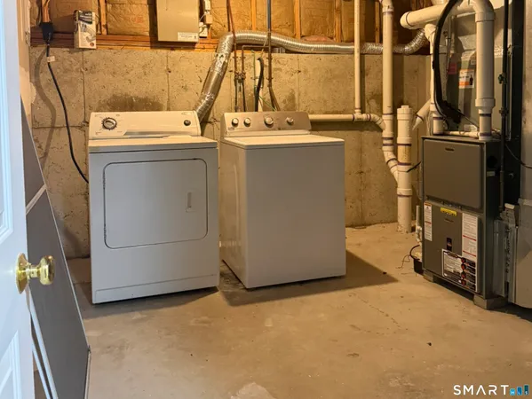 a view of a storage & utility room with washer and dryer