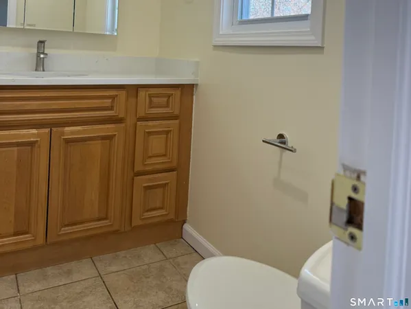 a bathroom with a toilet and a sink