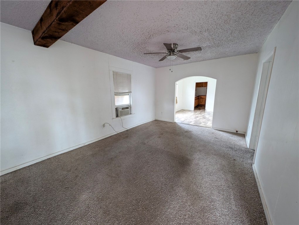1114 11th Street Corpus Christi, TX 78404 - Photo 4 of 16 a view of a livingroom with a ceiling fan and window