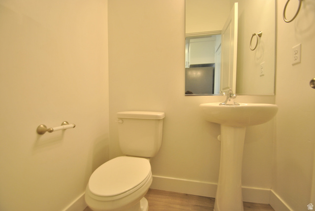 1219 West 1870 South Logan, UT 84321 - Photo 5 of 18 Half bathroom featuring baseboards and wood finished floors