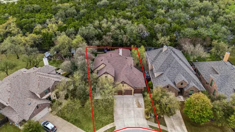 an aerial view of a house with outdoor space