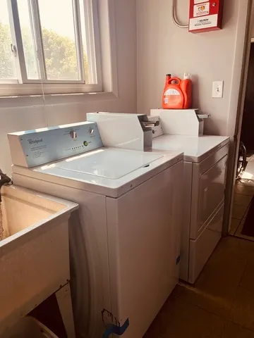 a utility room with dryer and washer