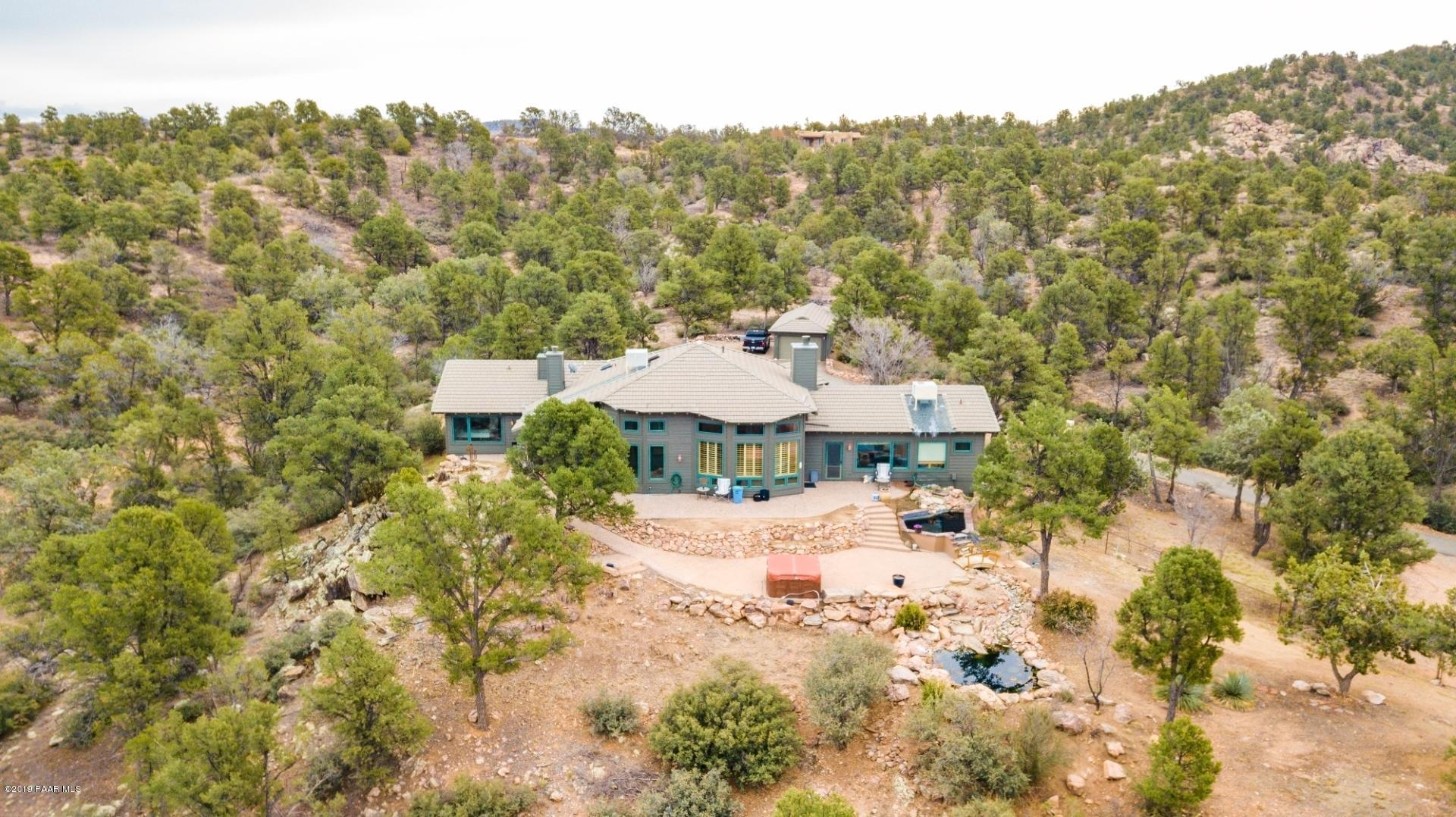 16500 Petroglyph Road Prescott, AZ 86305 - Photo 59 of 71 a view of a house with a yard