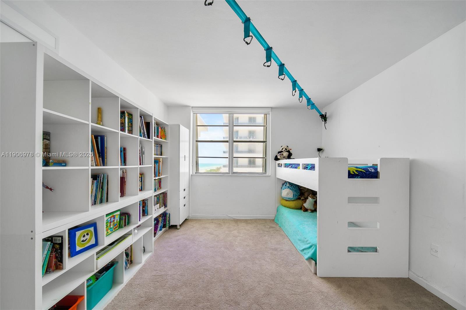 5825 Collins Avenue, Unit 10G Miami Beach, FL 33140 - Photo 38 of 51 a room with furniture and white walls