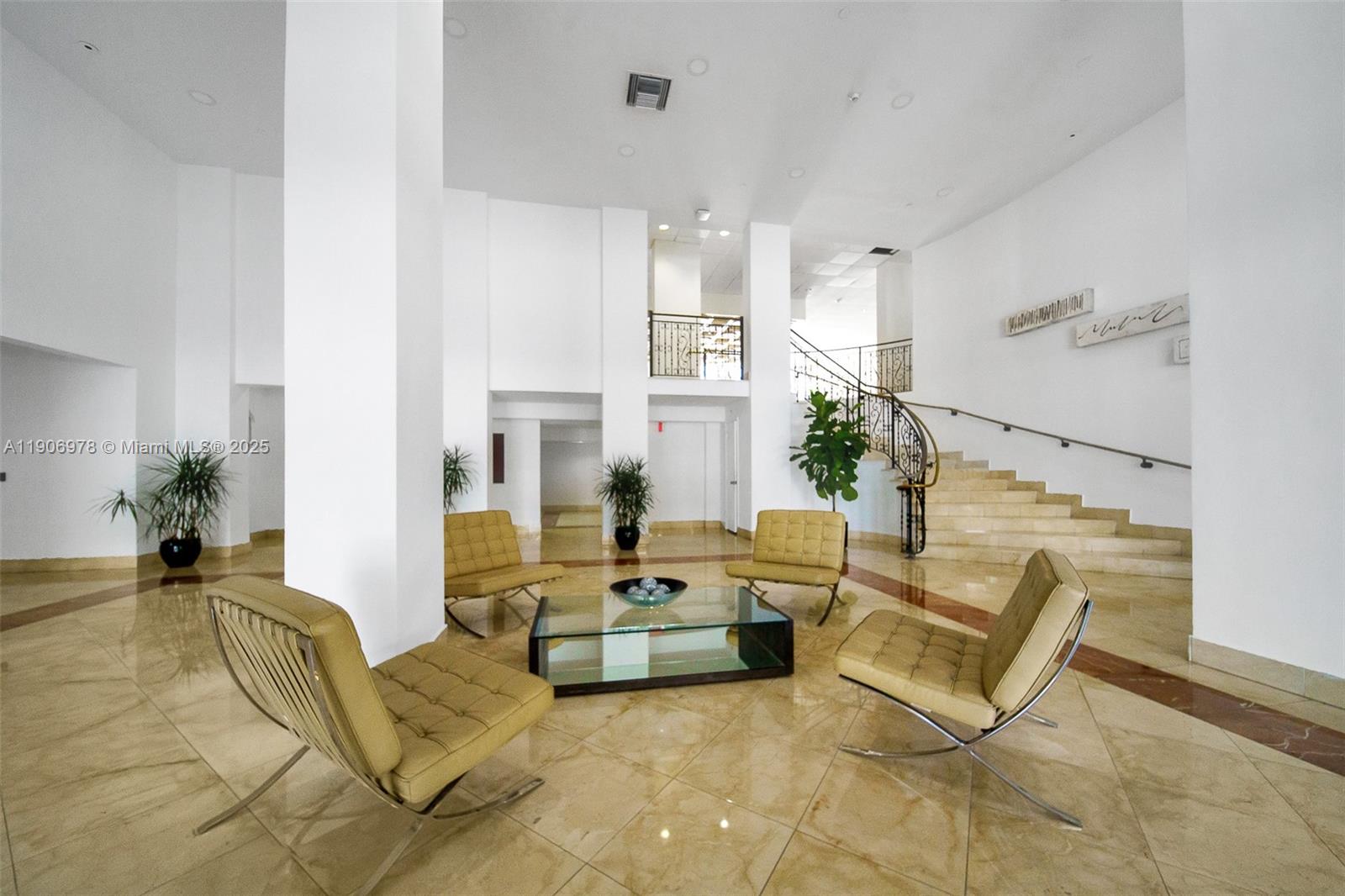 5825 Collins Avenue, Unit 10G Miami Beach, FL 33140 - Photo 48 of 51 a living room with furniture