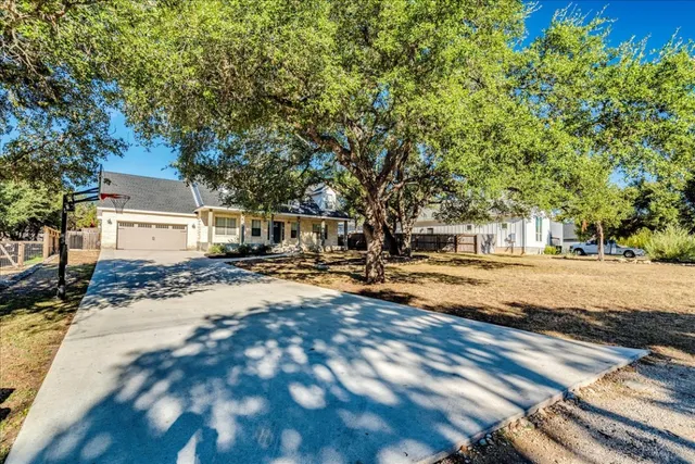 a view of a yard with car parked