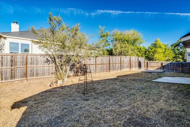 a view of backyard with green space