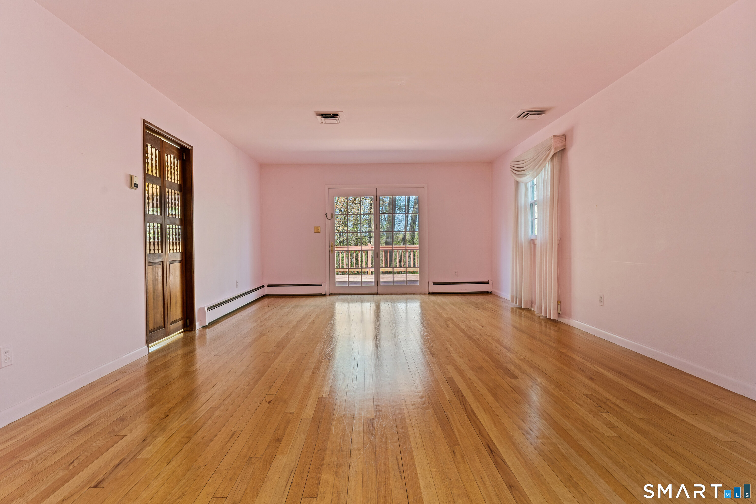 251 Shelter Rock Road Fairfield, CT 06825 - Photo 6 of 38 wooden floor in an empty room with a window