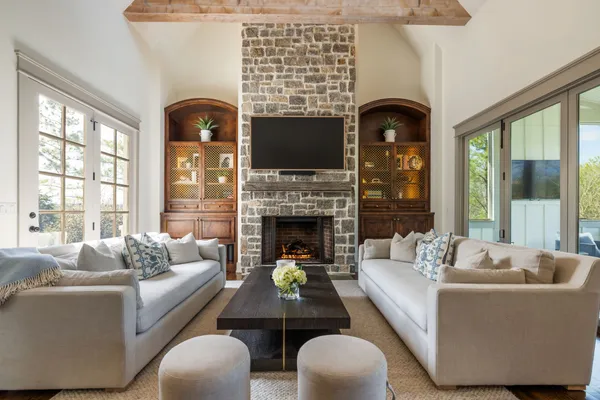 a kitchen with stainless steel appliances granite countertop a stove and a wooden floors