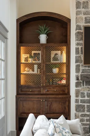 a kitchen with a sink stove and wooden floor