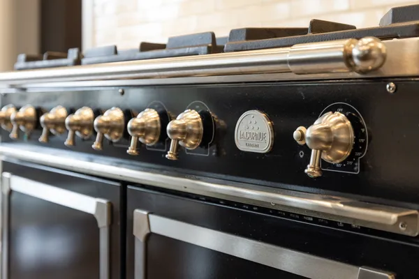 a white bath tub sitting in a bathroom next to a window