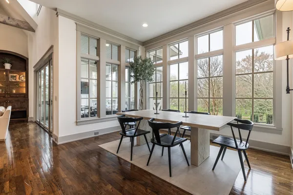 a bed sitting in a balcony next to a yard
