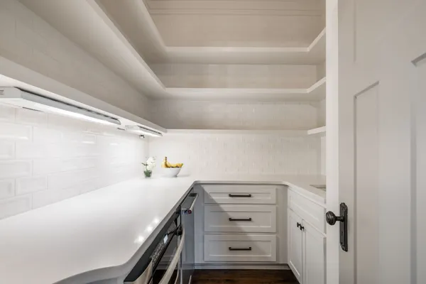 a bedroom with a bed and a potted plant