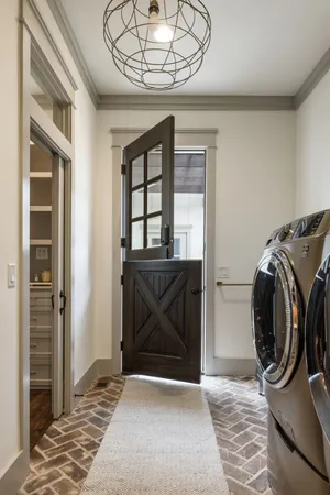 a bathroom with a double vanity sink toilet and shower