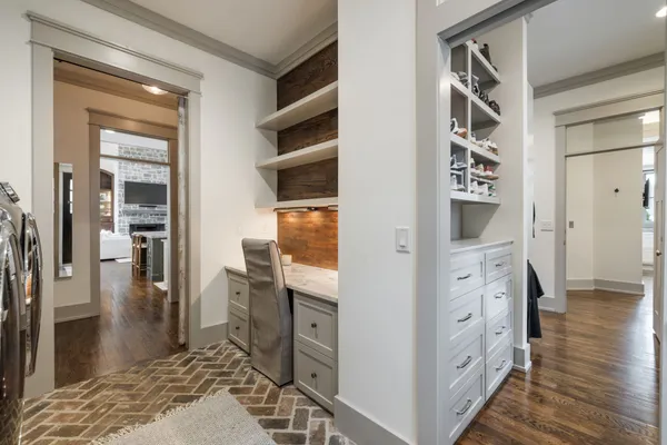 a living room with furniture wooden floor and a fireplace