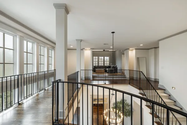 a view of a patio with table and chairs with wooden fence and plants