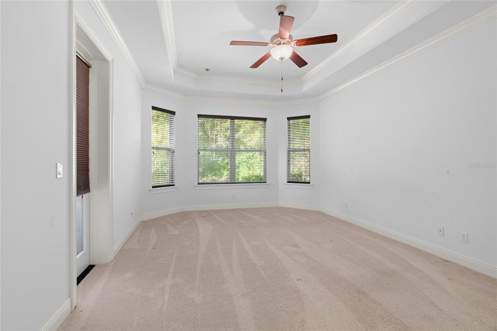 4117 Southeast 21st Street Ocala, FL 34471 - Photo 15 of 38 an empty room with windows and fan