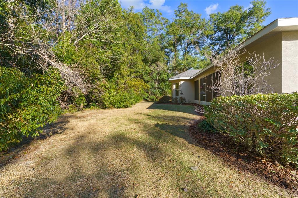 4117 Southeast 21st Street Ocala, FL 34471 - Photo 36 of 38 a view of a house with a yard