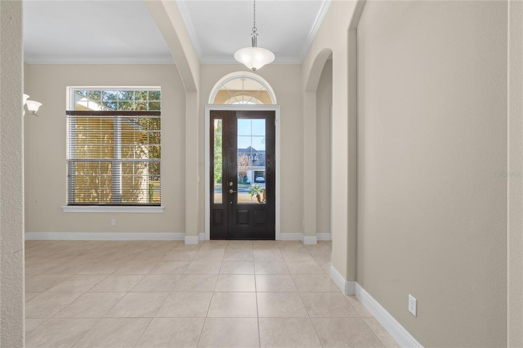 4117 Southeast 21st Street Ocala, FL 34471 - Photo 7 of 38 a view of an entryway with a chandelier