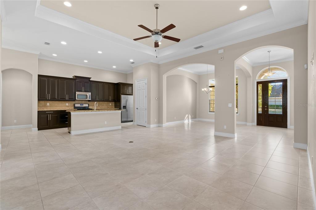 4117 Southeast 21st Street Ocala, FL 34471 - Photo 9 of 38 a view of a kitchen with a sink and a stove top oven