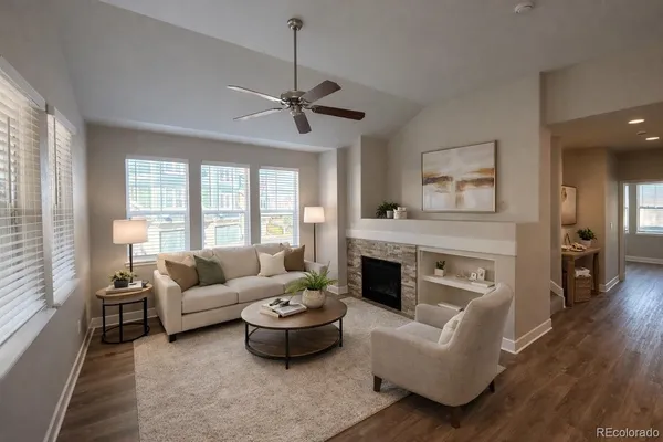 a view of kitchen with granite countertop a stove top oven a sink and a refrigerator