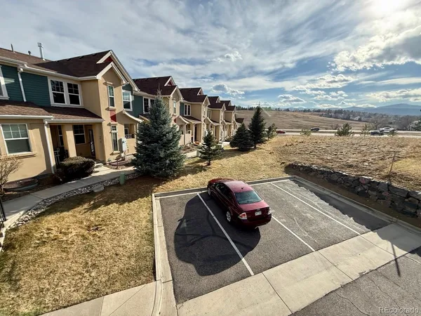 a large kitchen with stainless steel appliances granite countertop a sink a refrigerator and a stove