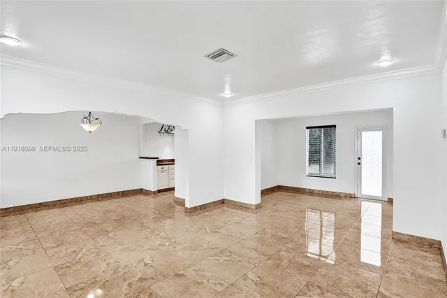 a view of a kitchen with a sink stainless steel appliances and cabinets