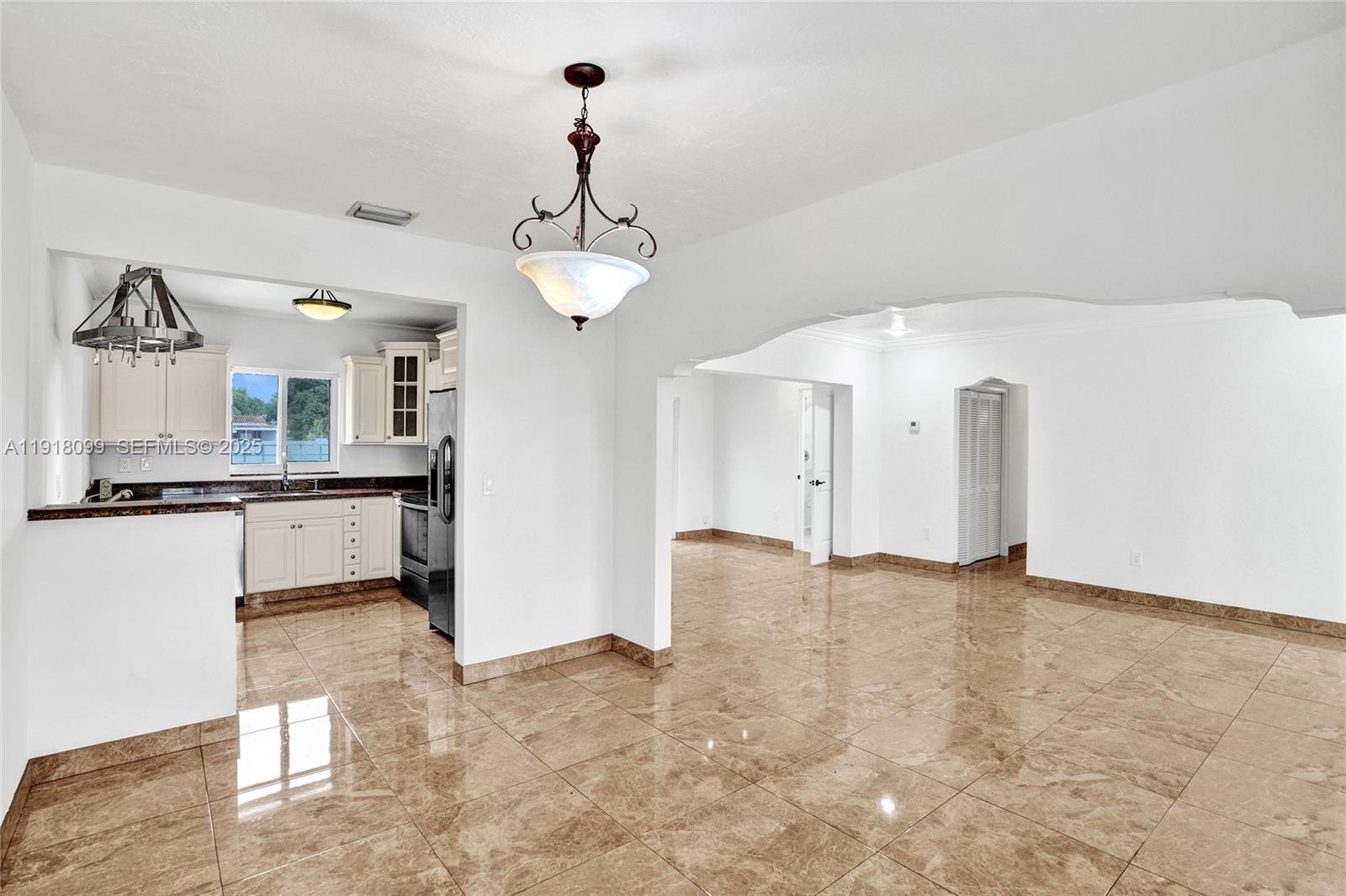 5801 Southwest 20th Street Miami, FL 33155 - Photo 12 of 40 a view of a kitchen with a sink stainless steel appliances and cabinets