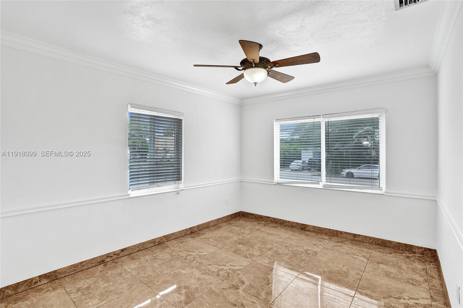 5801 Southwest 20th Street Miami, FL 33155 - Photo 18 of 40 a view of an empty room with a window