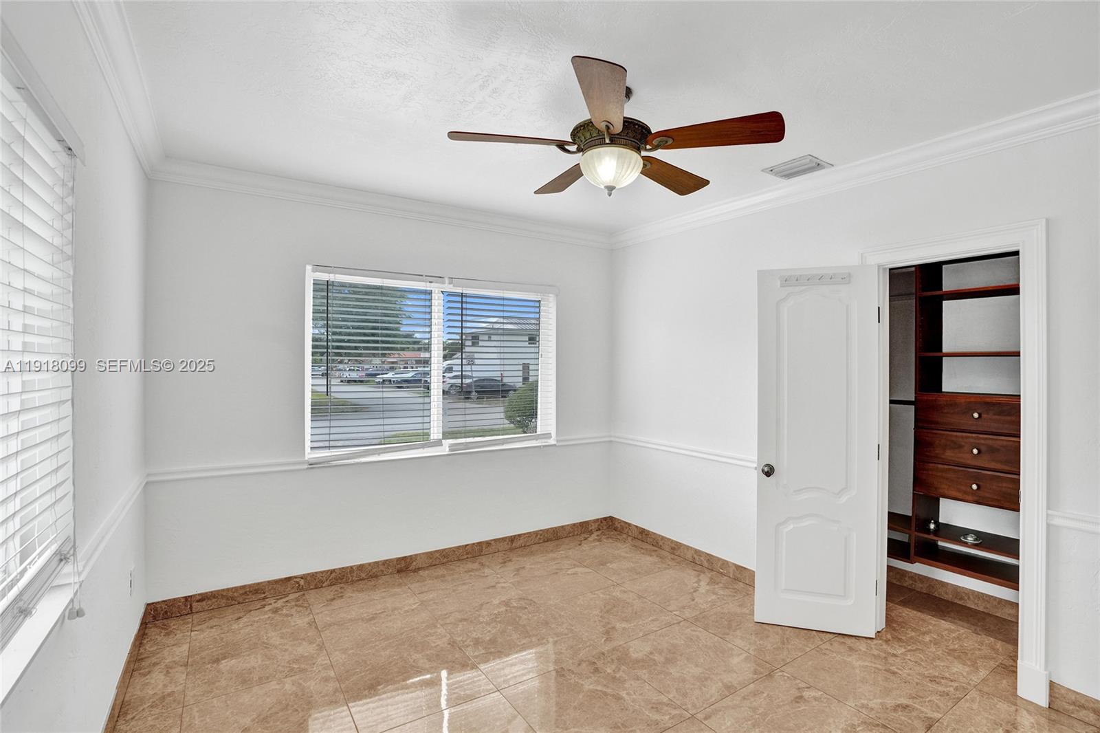 5801 Southwest 20th Street Miami, FL 33155 - Photo 21 of 40 a view of an empty room with a window
