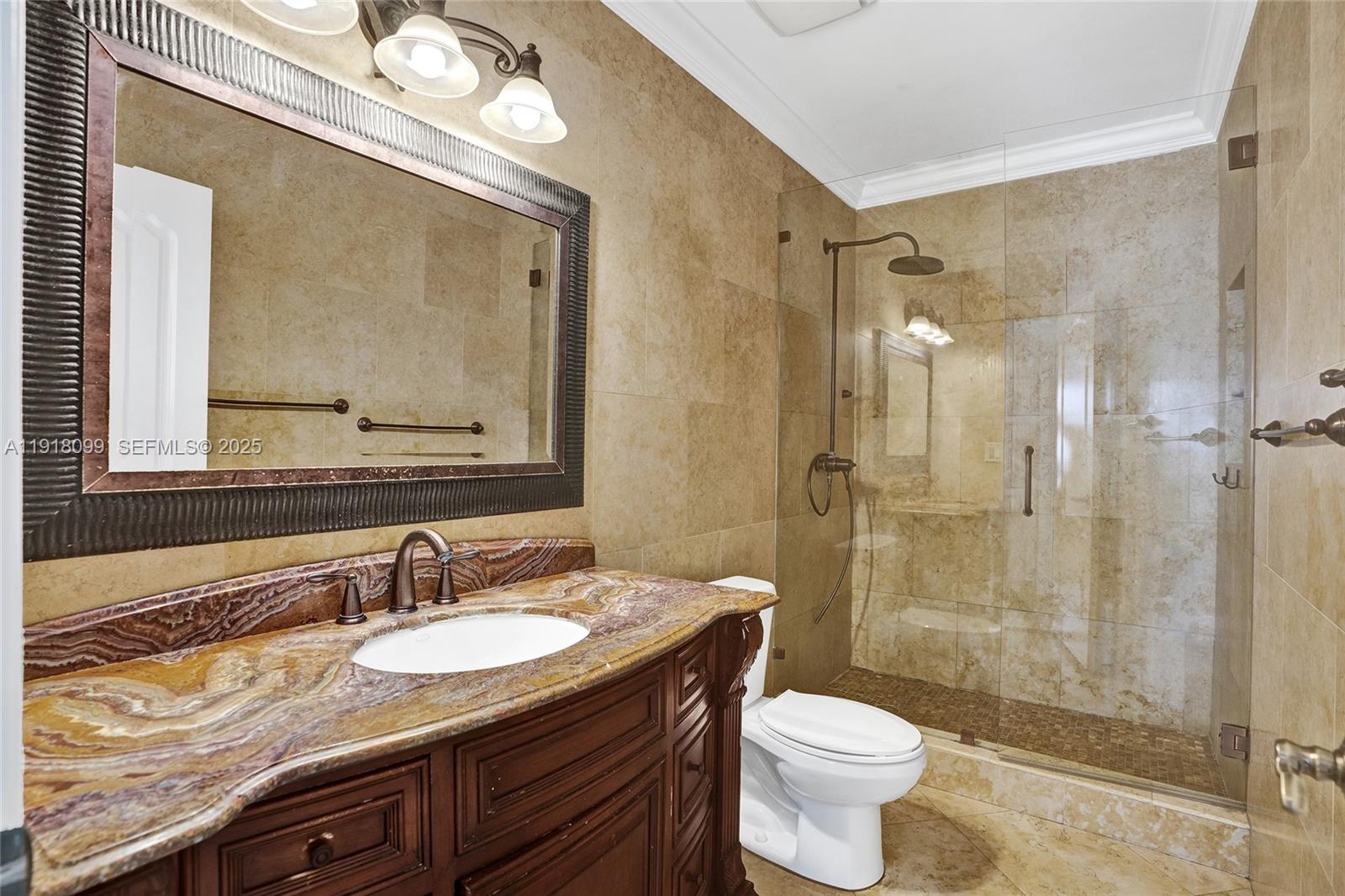 5801 Southwest 20th Street Miami, FL 33155 - Photo 22 of 40 a bathroom with a sink toilet mirror and shower
