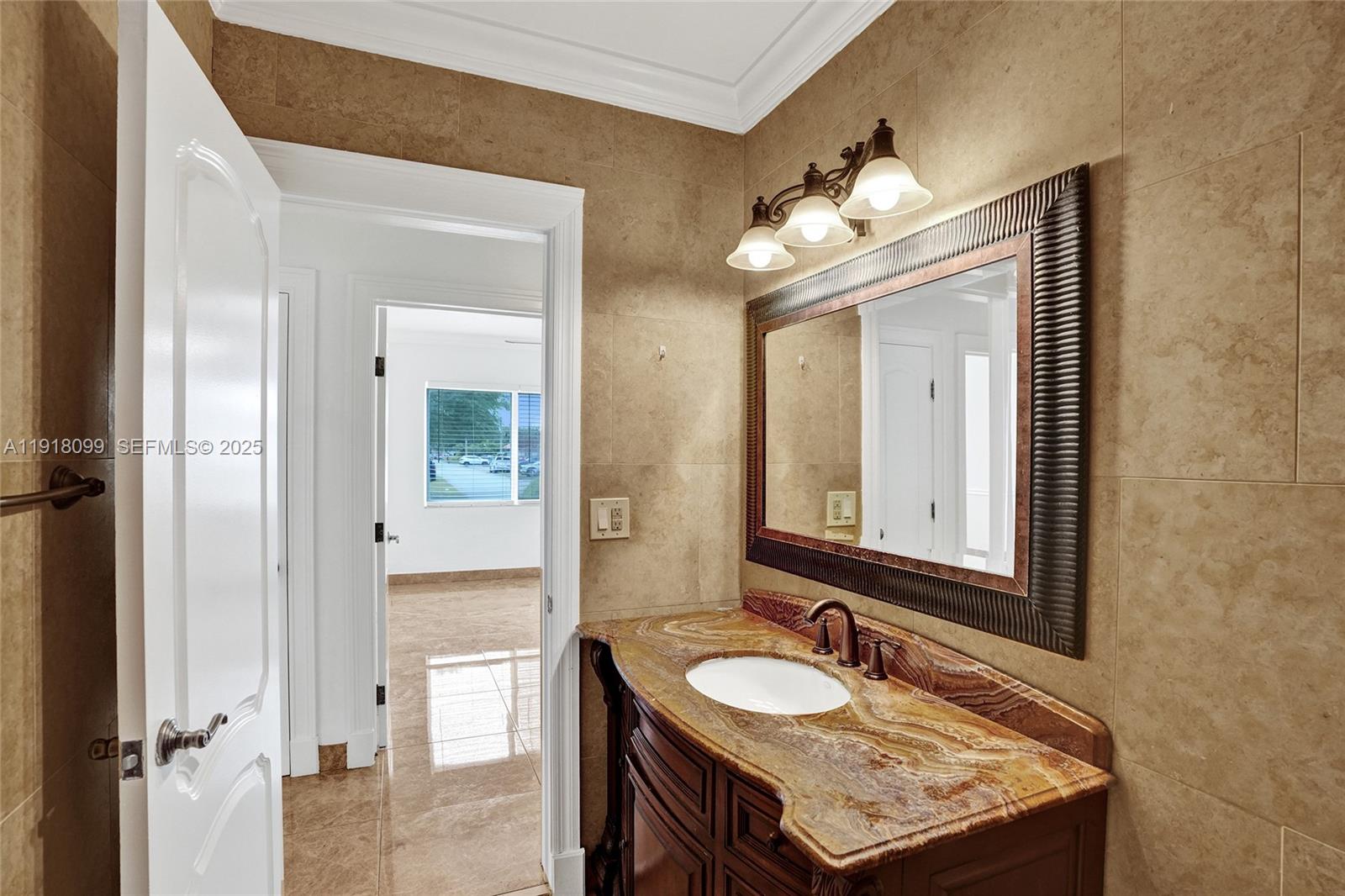 5801 Southwest 20th Street Miami, FL 33155 - Photo 23 of 40 a bathroom with a granite countertop sink and a mirror