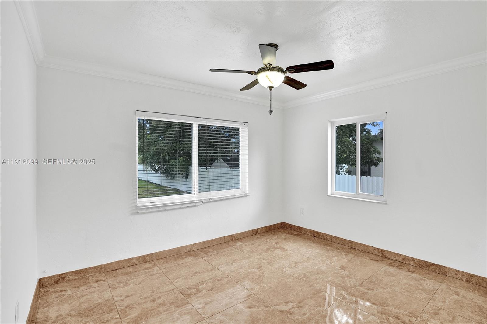 5801 Southwest 20th Street Miami, FL 33155 - Photo 24 of 40 a view of empty room with windows
