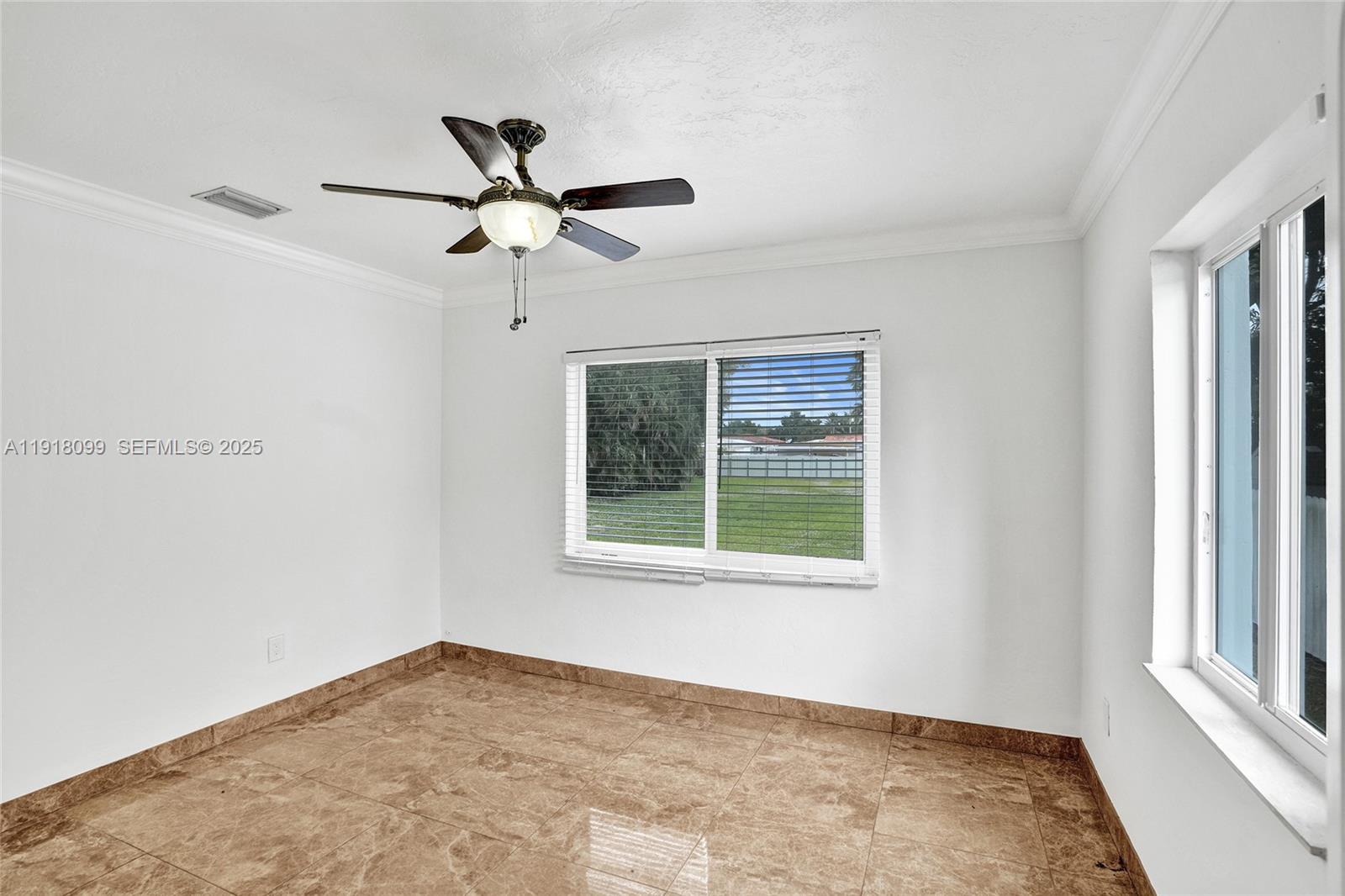 5801 Southwest 20th Street Miami, FL 33155 - Photo 27 of 40 a view of an empty room with a window