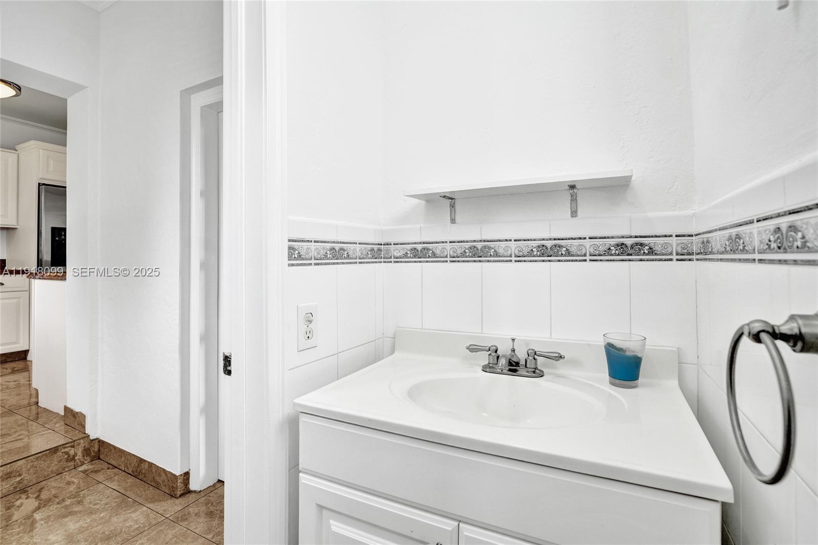 5801 Southwest 20th Street Miami, FL 33155 - Photo 29 of 40 a bathroom with a sink a mirror and shower