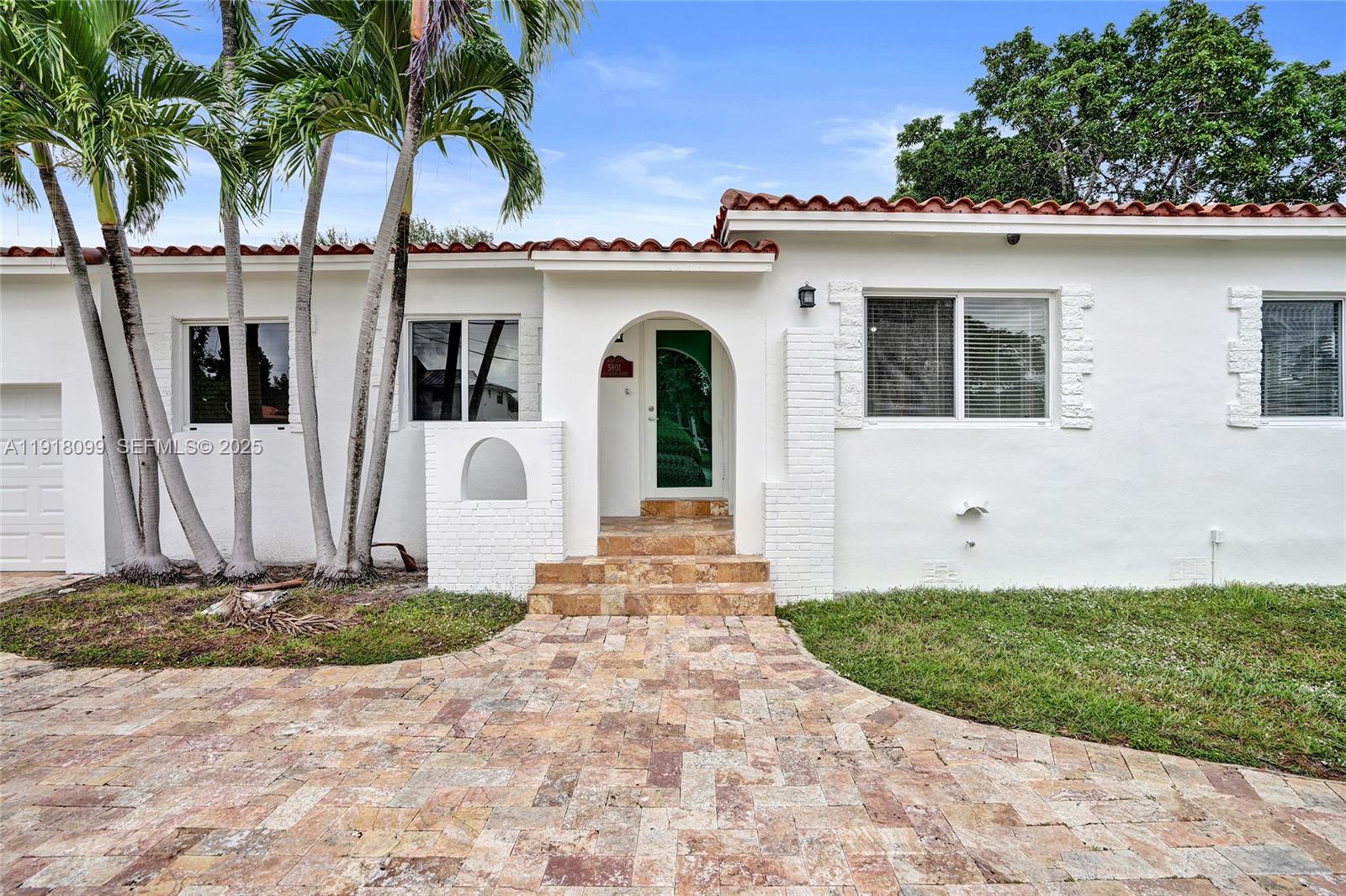 5801 Southwest 20th Street Miami, FL 33155 - Photo 35 of 40 a front view of a house with a yard