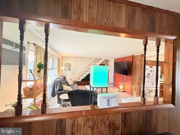 a view of living room with furniture and a window