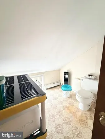 a view of an empty room and a window