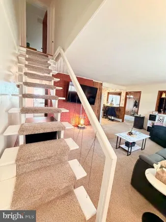 a living room with furniture and view of living room