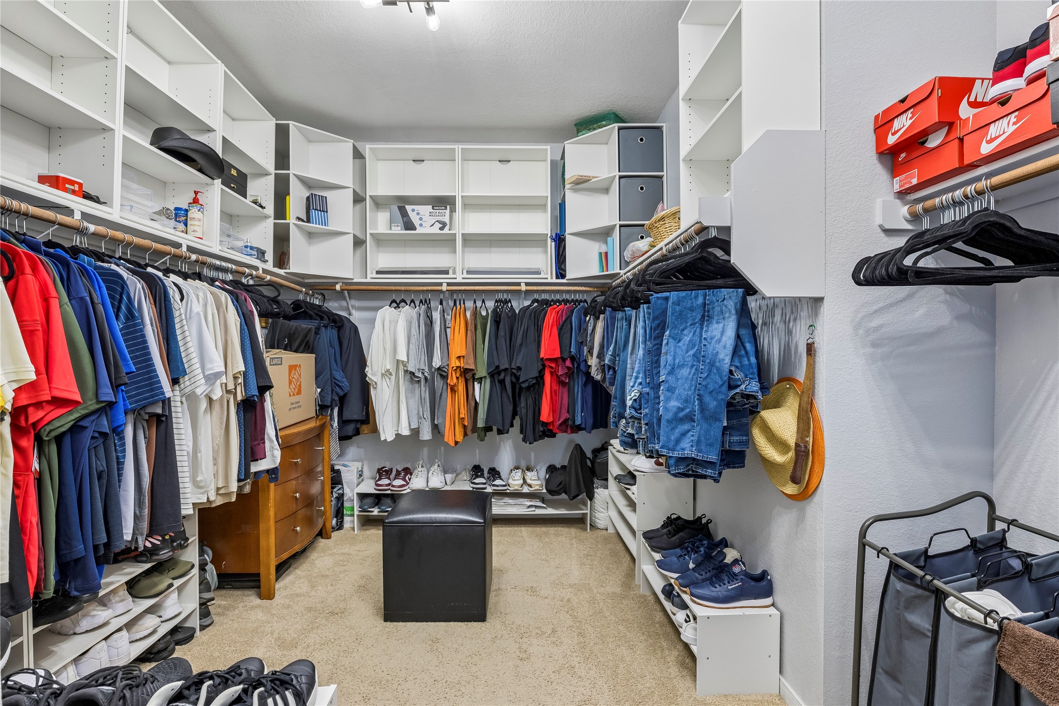 14409 Estuary Road Manor, TX 78653 - Photo 10 of 24 Custom closet organization system featuring white shelving and hanging rods
